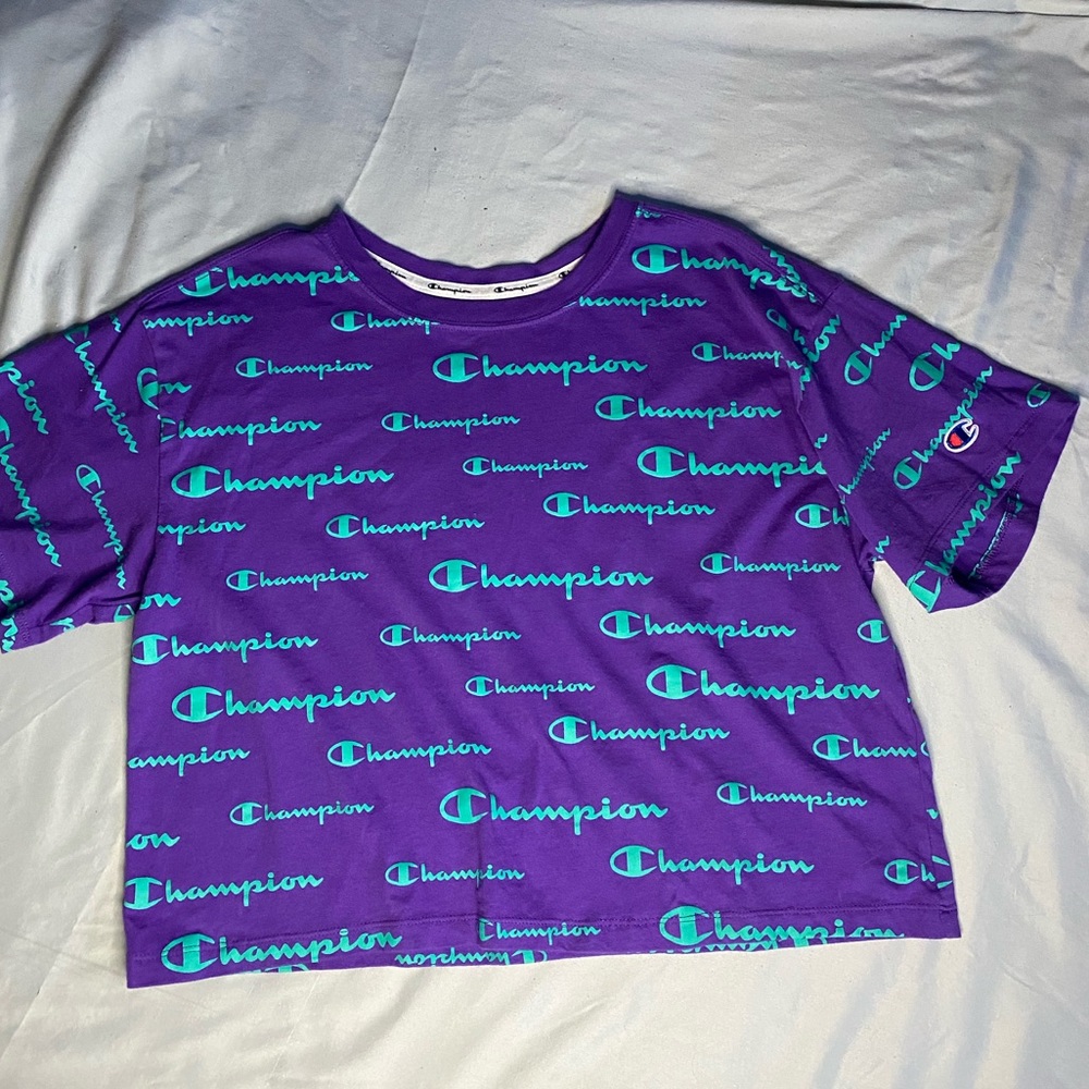 Champion crop top purple with logo all over.